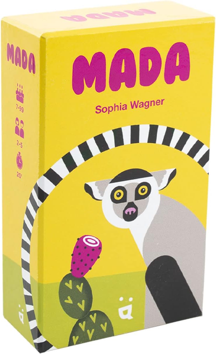 The image shows the packaging of the board game 'Mada'. The box is predominantly yellow with an illustration of a lemur and a cactus.