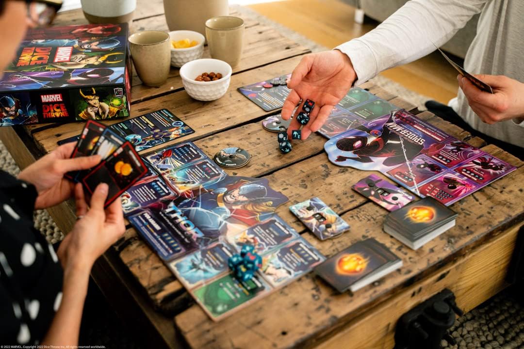 Family playing Dice Throne on a kitchen table