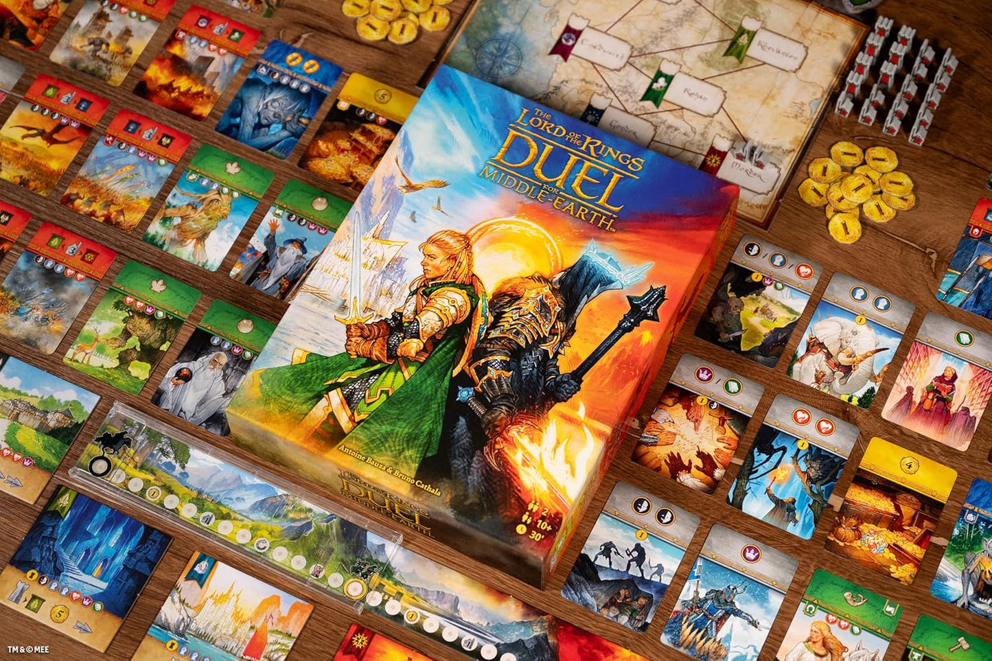 Board game 'The Lord of the Rings: Duel' with character cards and tokens on a wooden surface.