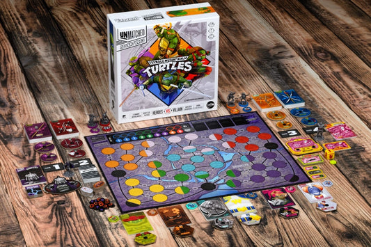 Unmatched Adventures: Teenage Mutant Ninja Turtles product packaging and contents laid out on a wooden table