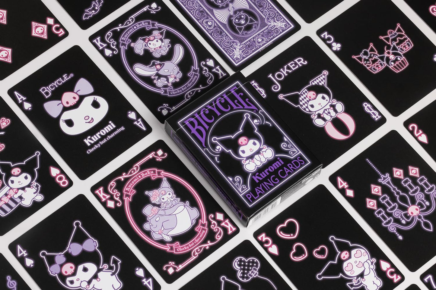Collection of Bicycle playing cards with cartoon character designs on a black background
