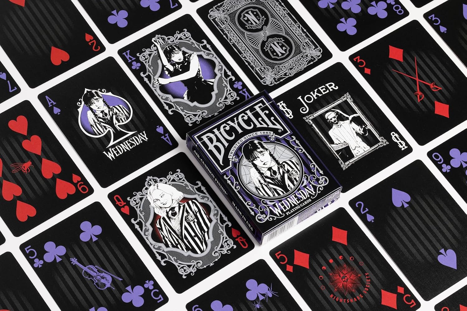 Bicycle playing cards with black and red design on a matching card background