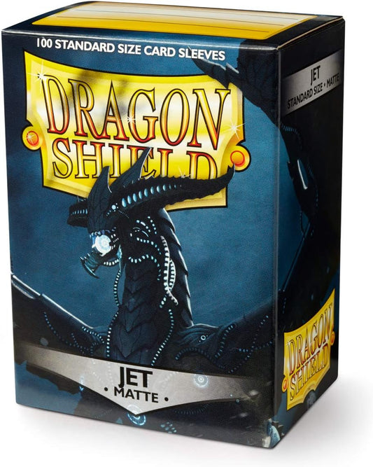 A box of Dragon Shield standard size matte card sleeves in Jet black colour, with the product name and dragon illustration on the packaging.