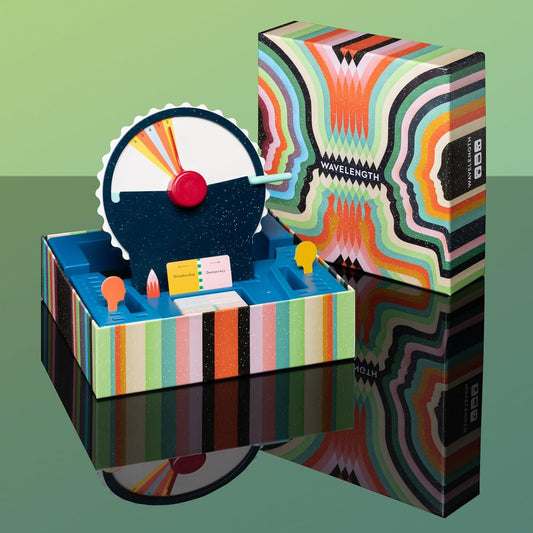 Wavelength by CMYK product packaging featuring geometric patterns on a reflective surface.