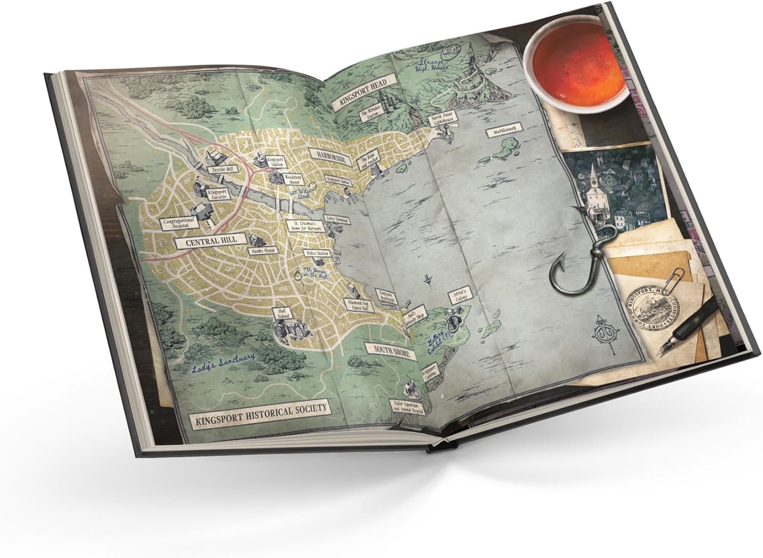 Open book with a detailed map and vintage-style illustrations on a white background