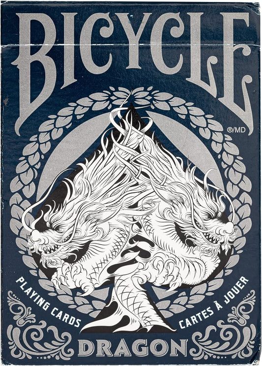 packaging of Bicycle Dragon Playing Cards featuring a detailed, monochrome illustration of a dragon surrounded by ornate designs, with the Bicycle brand prominently shown.