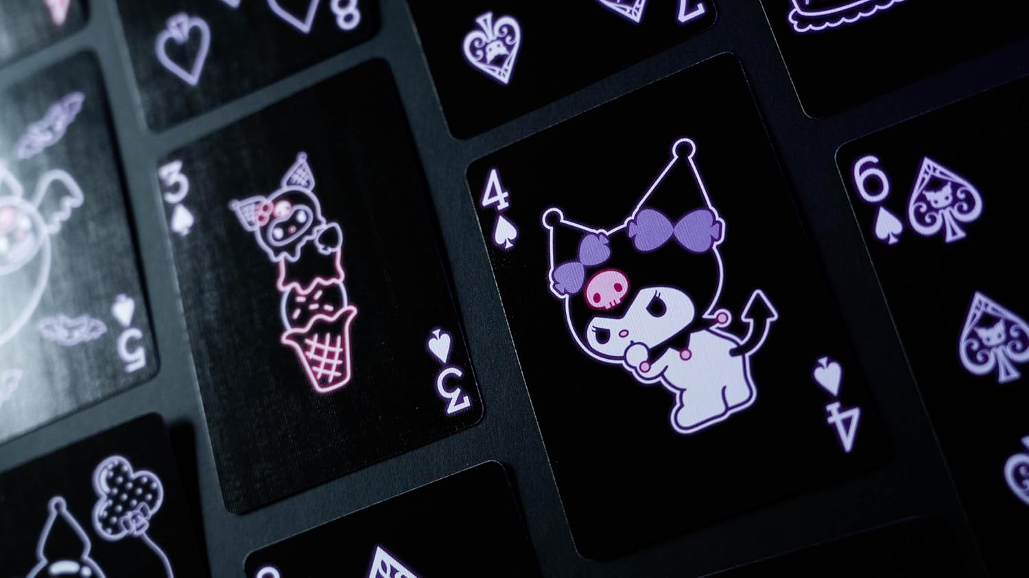 Glowing playing cards with cartoon characters on a dark background