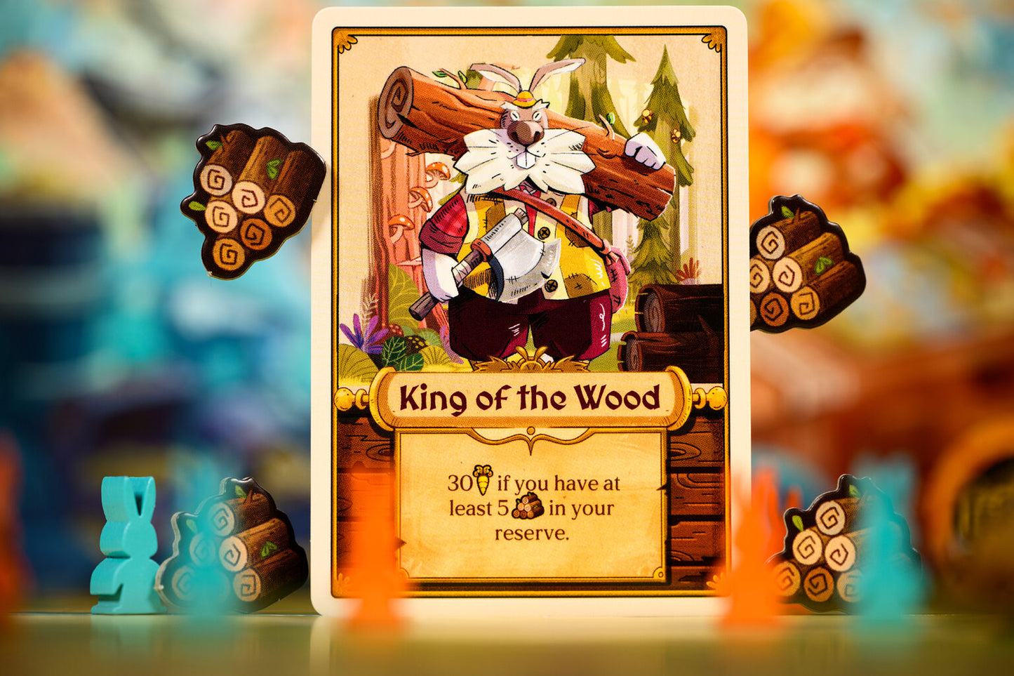 Bunny Kingdom Town Card titled 'King of the Wood' from a game, with decorative elements and blurred background