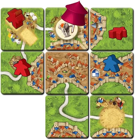 Set of board game cards with colorful illustrations and game pieces on a white background