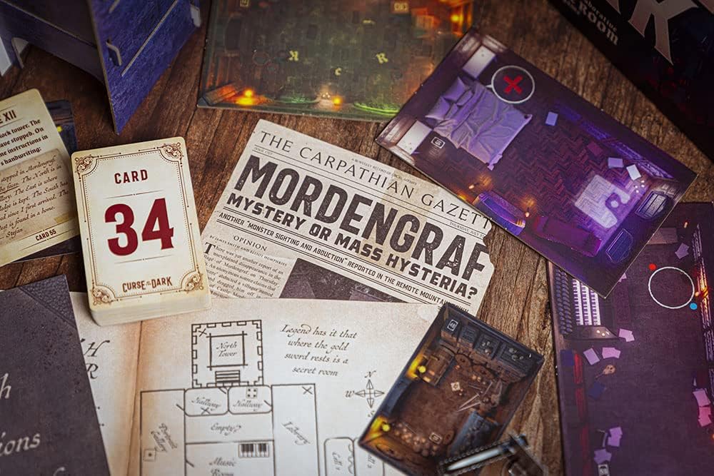 Curse of The Dark Box contents picturing maps, newspaper articles and pictures