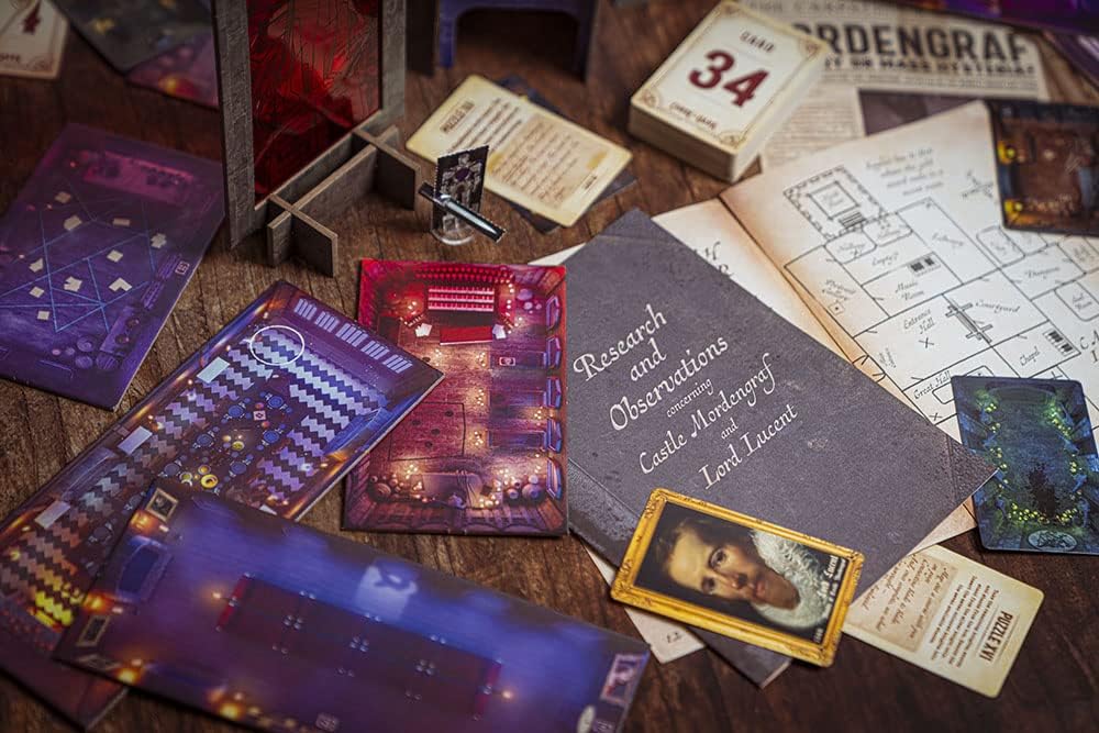Curse of The Dark Contents laid out on a wooden table