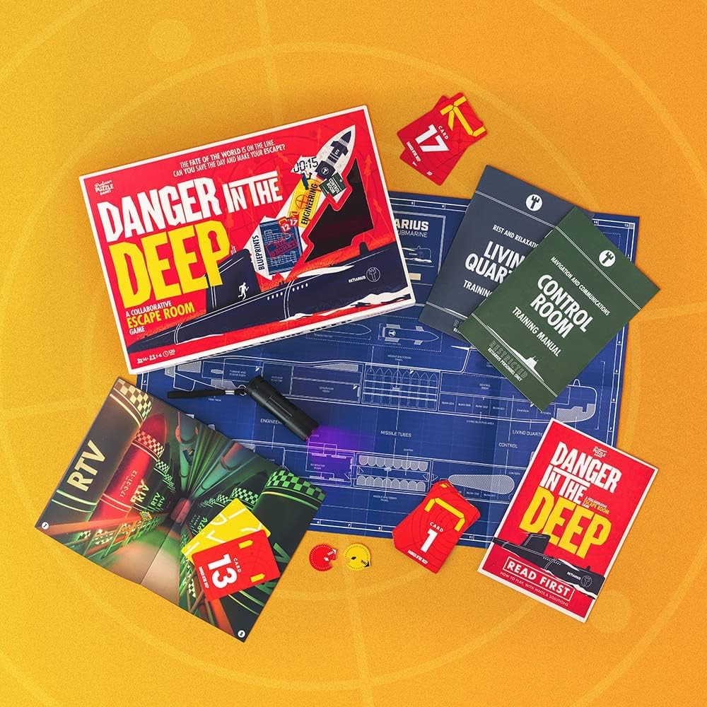 Danger in the Deep board game box and game booklets on a orange background