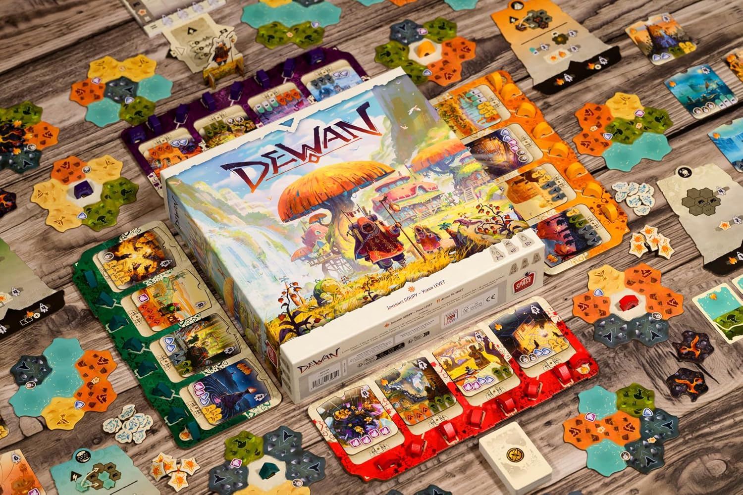 Board game 'Dewan' with colorful tiles on a wooden surface