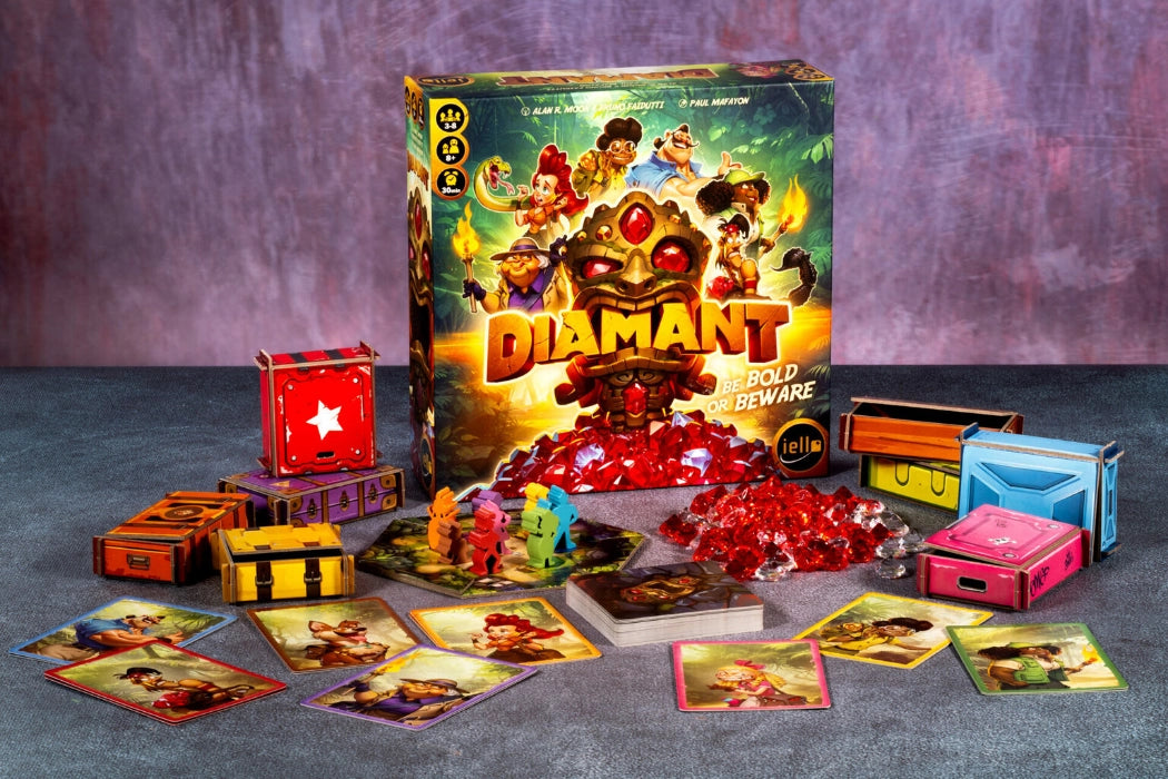 Board game set with 'Diamant' box and various game pieces on a textured surface.