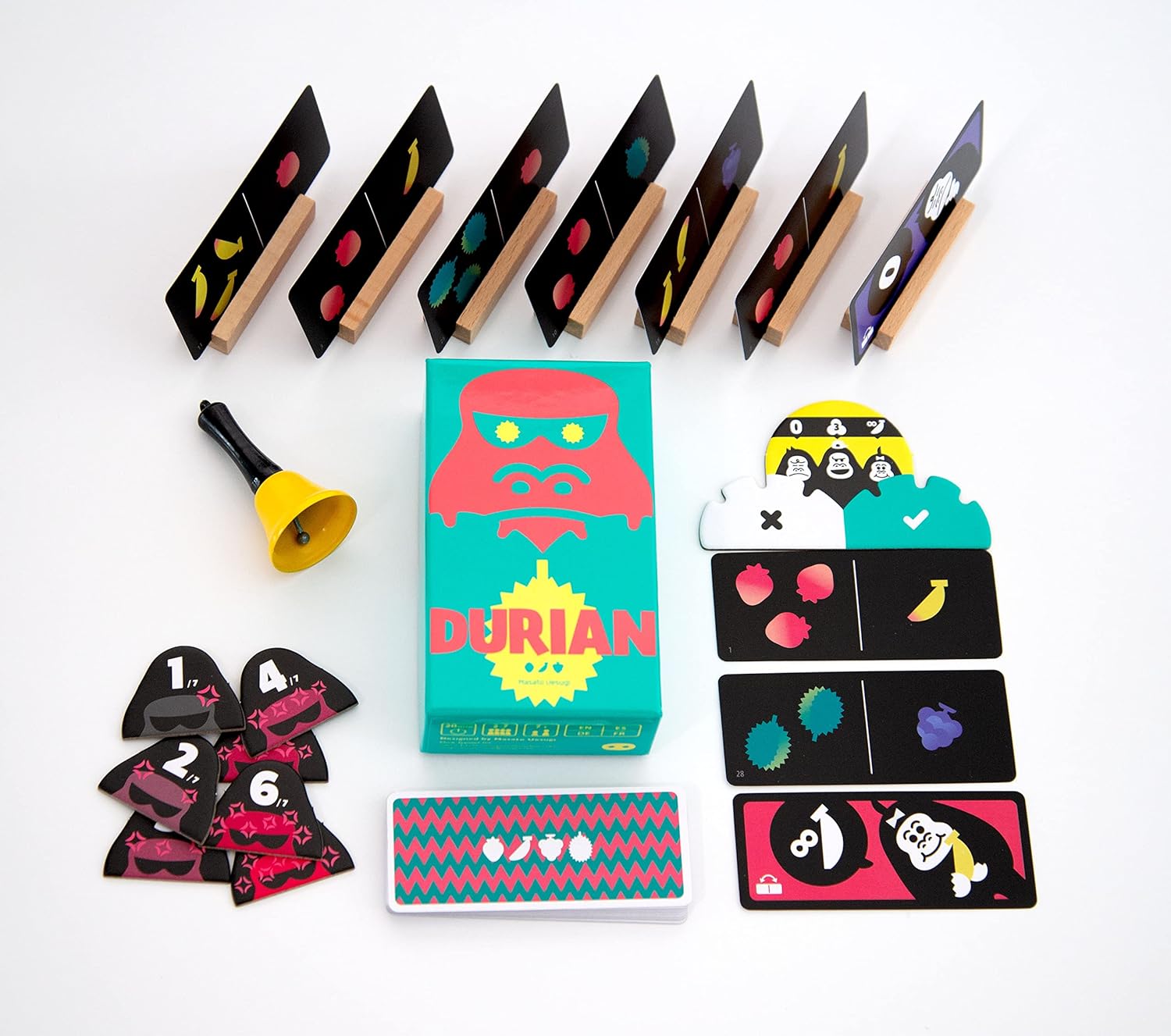 Durian board game components, including cards and a bell on a white background