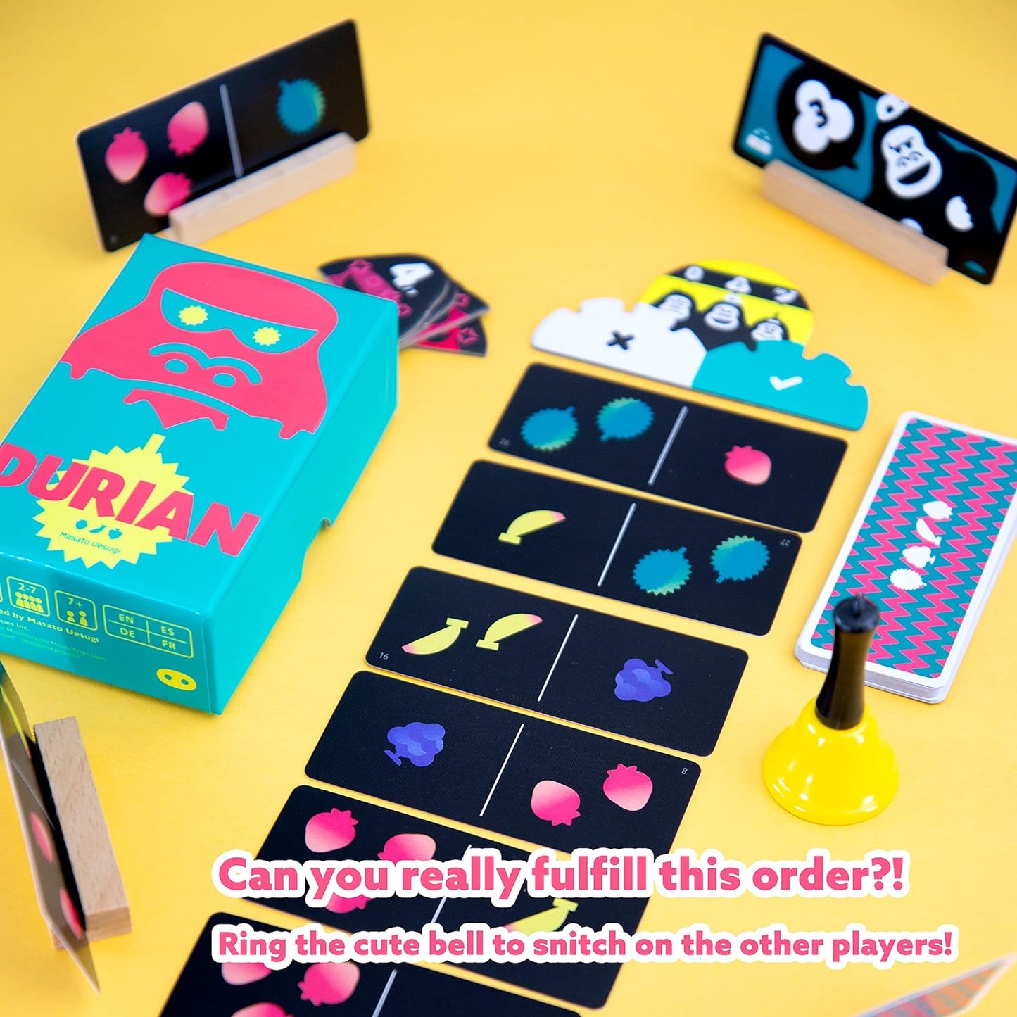 Durian card game with colourful cards and a box labelled 'Durian' on a yellow background.
