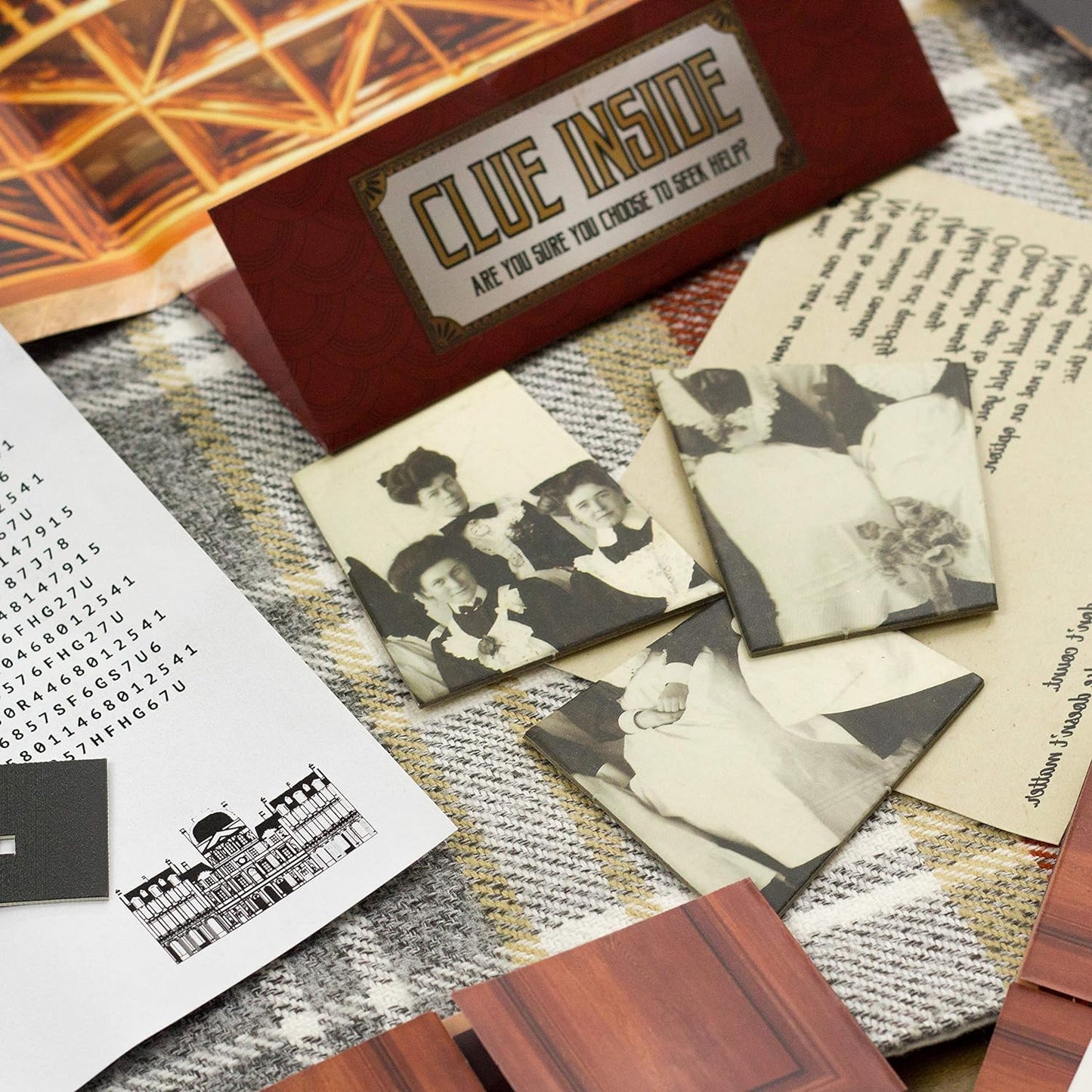 Vintage-style photo album with black and white photos and a 'Clue Inside' sign on a textured surface.