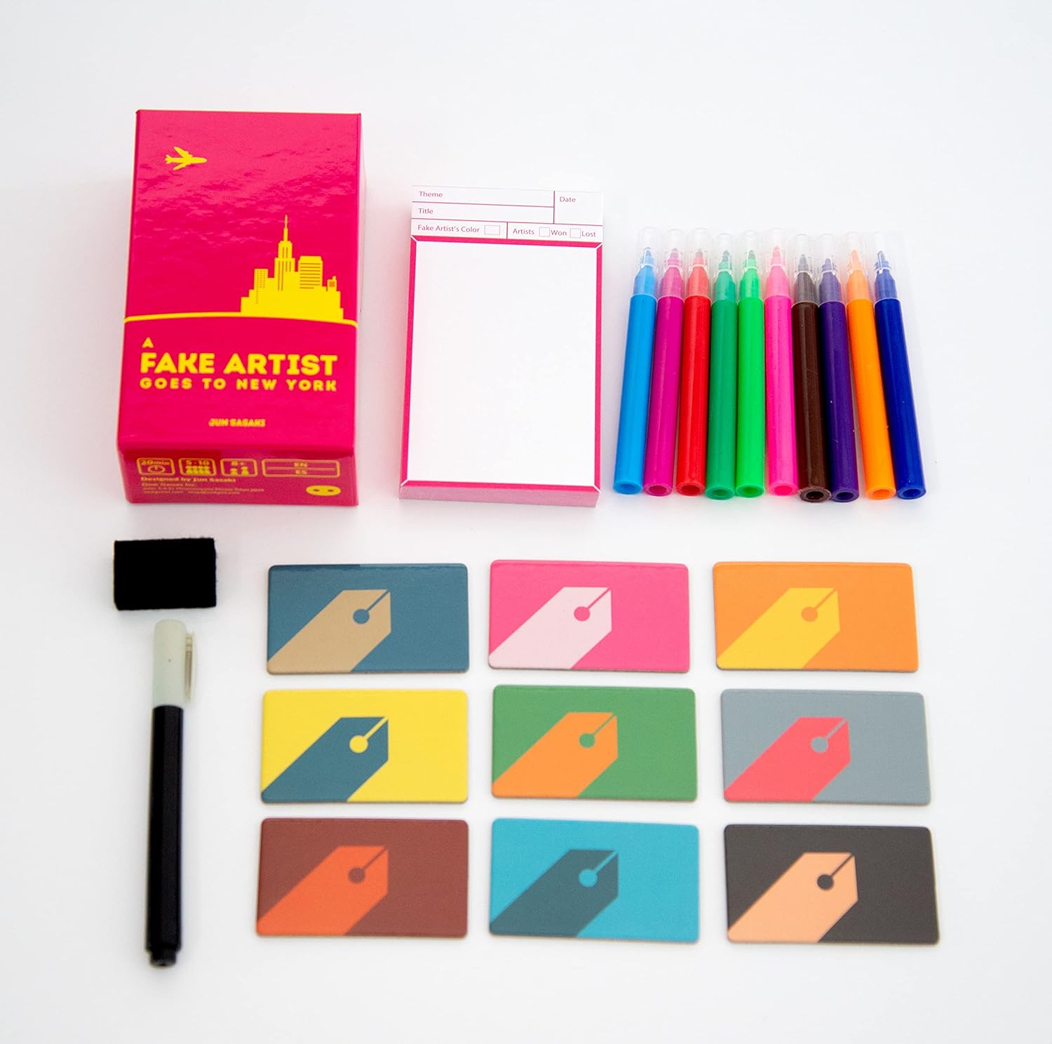 Colorful art supplies including markers, cards, and a book on a white background
