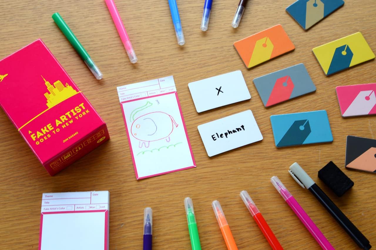 Colorful markers, cards, and stationery items on a wooden surface