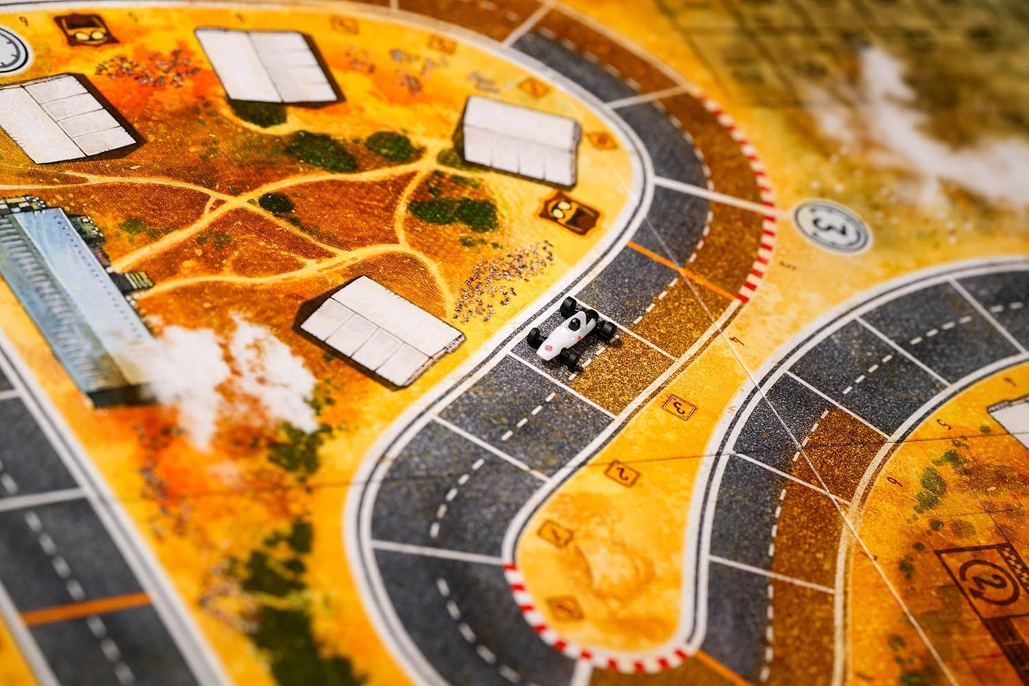 Board game with a yellow and brown map featuring roads and buildings