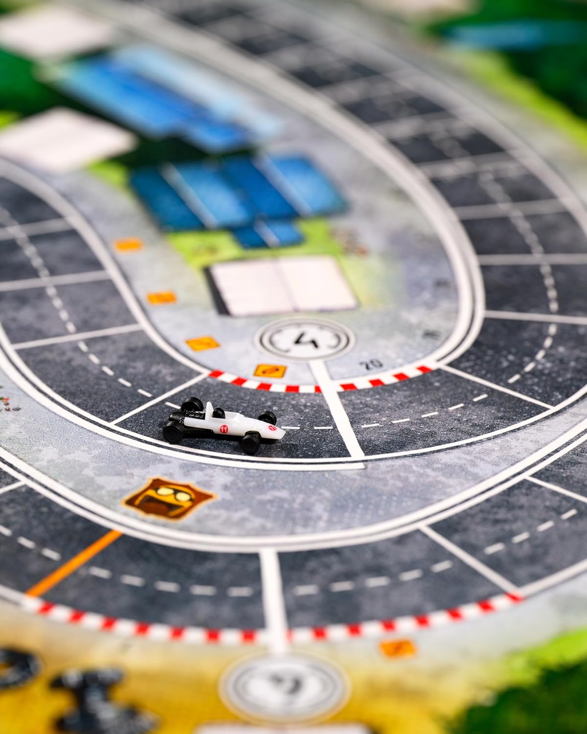 Close-up of a Heat Rocky Roads board game with a race track and car