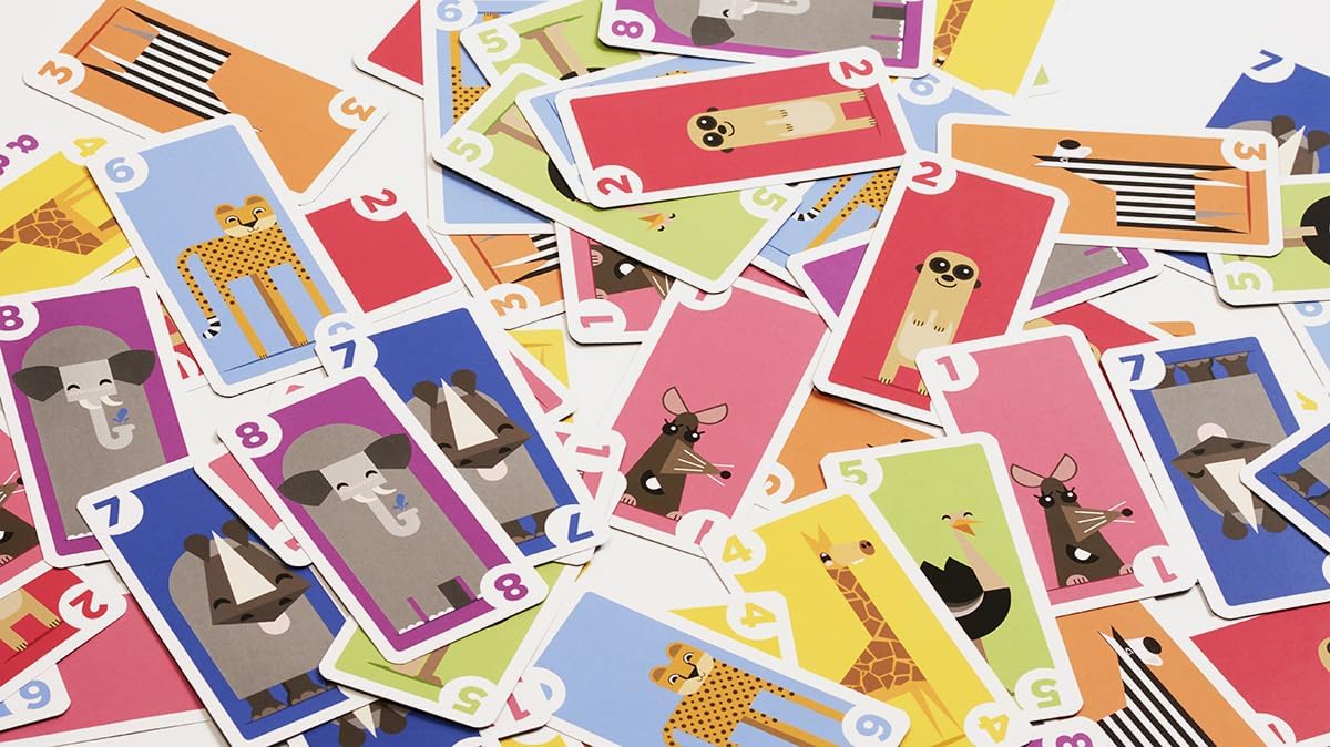 Colourful children's playing cards with animal illustrations on a white background
