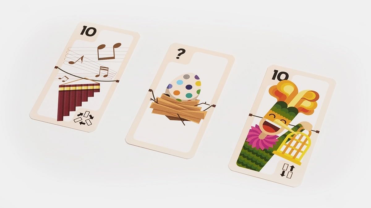 Three colourful playing cards with different designs on a white background