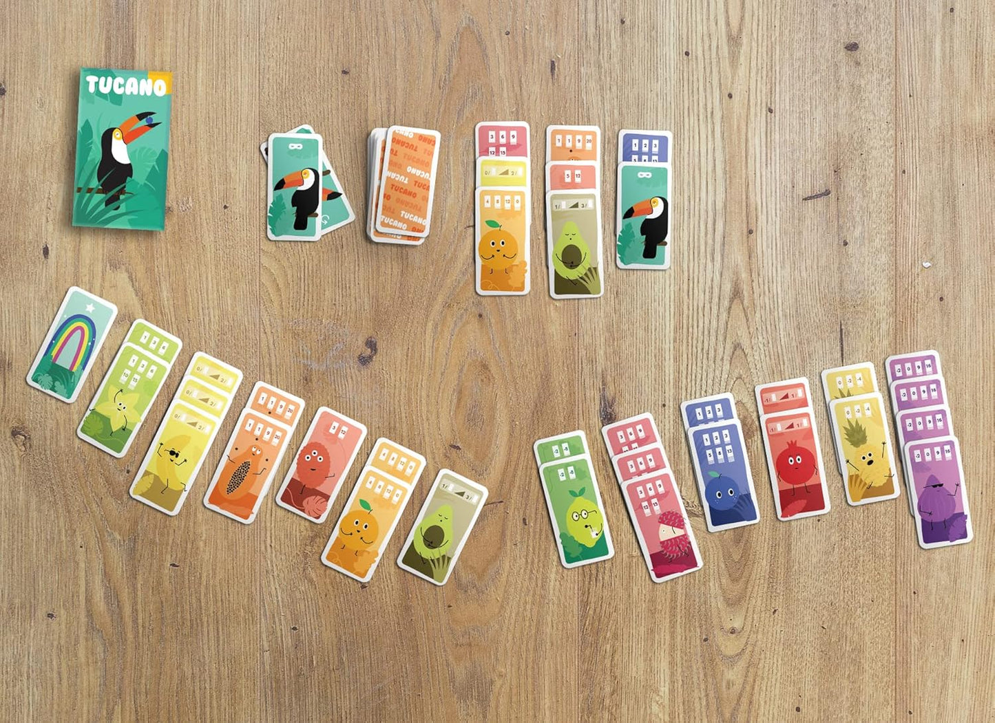 Colourful card game pieces on a wooden surface