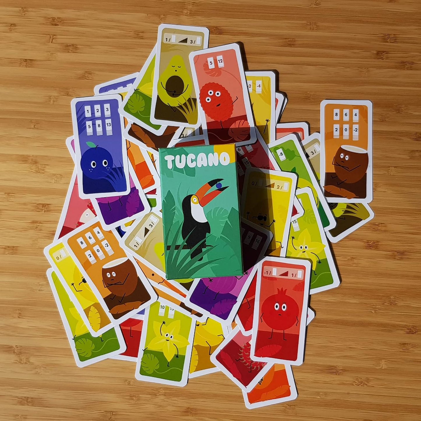 Colourful card game pieces on a wooden surface