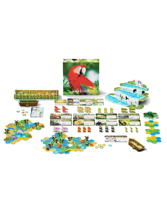 Life of the Amazonia board game set with a colourful parrot game box, player boards, cards, tokens, terrain pieces, and small wooden boat pieces arranged on a white background.