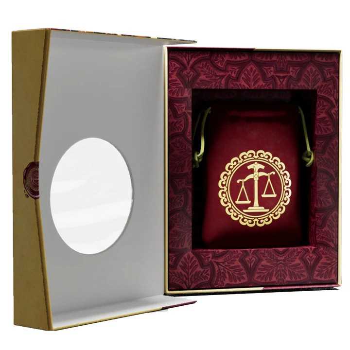 Decorative box with a gold emblem on a red background