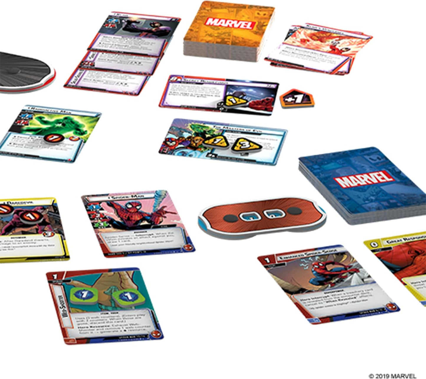 Collection of Marvel-themed trading cards and game components on a white background