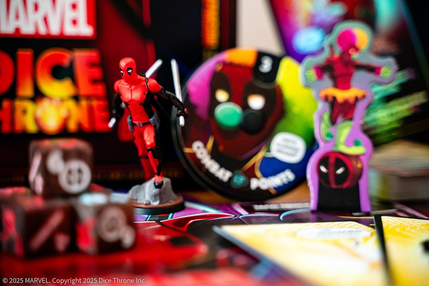 Deadpool figurine and dice on a table with colourful background