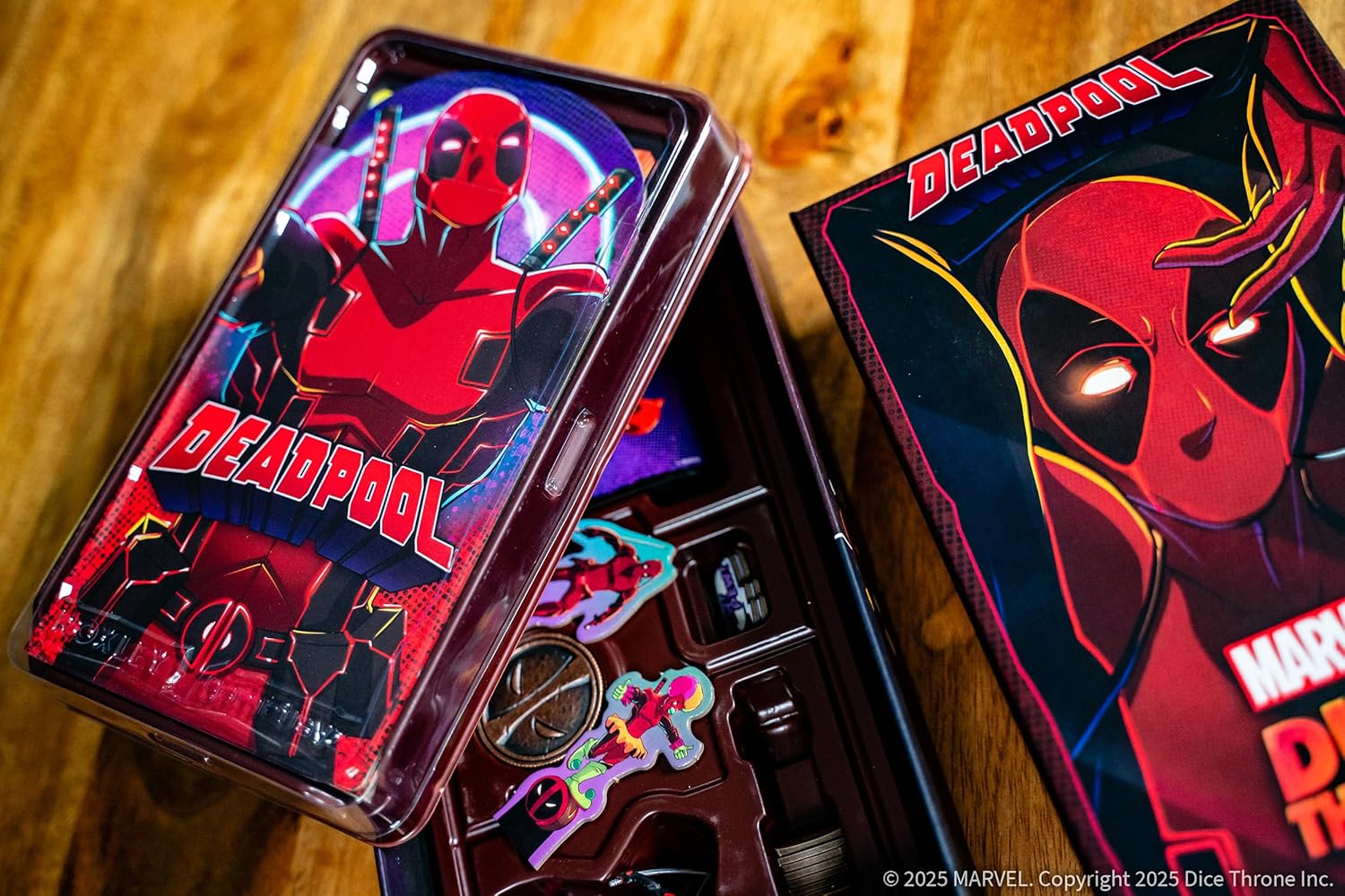 Deadpool-themed product packaging on a wooden surface