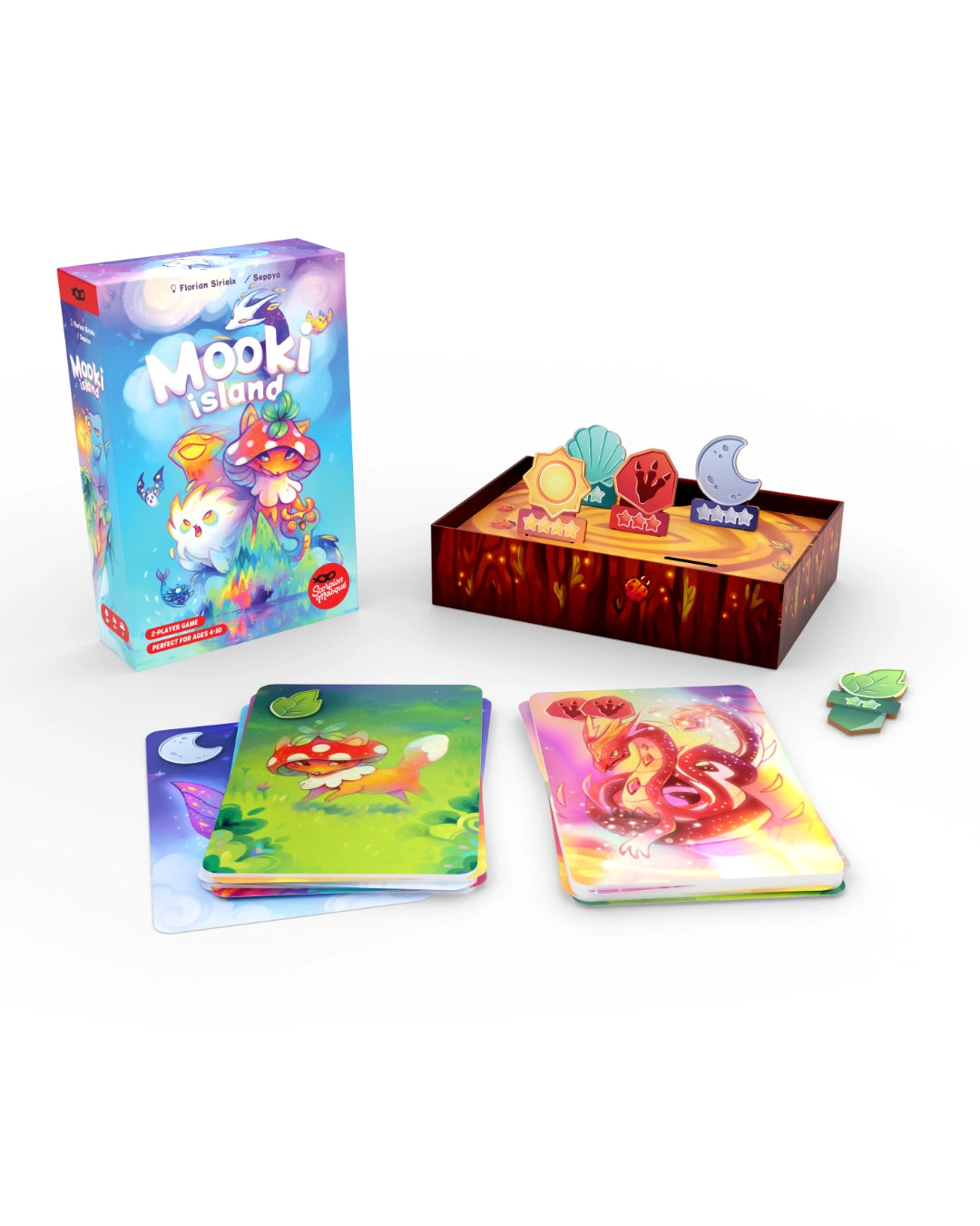 Mooki Island board game set on a white background, showing the colourful game box, a wooden play mat with game pieces, and several illustrated cards.