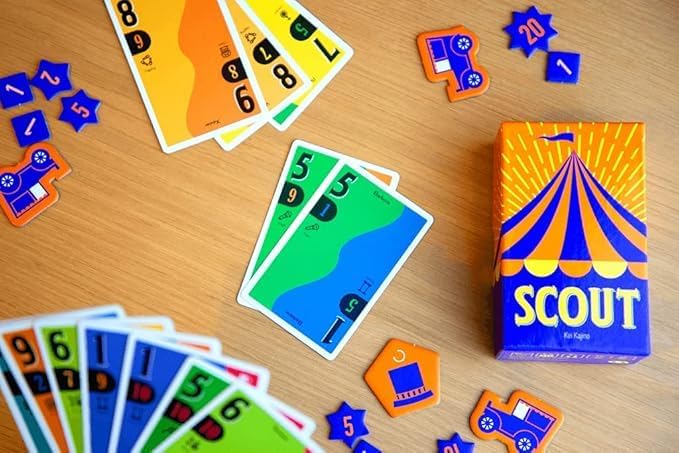 Scout card game components on a wooden surface