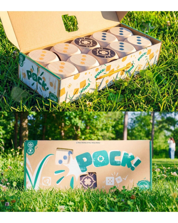 pock outdoor dice game open showing large dice on a grass lawn