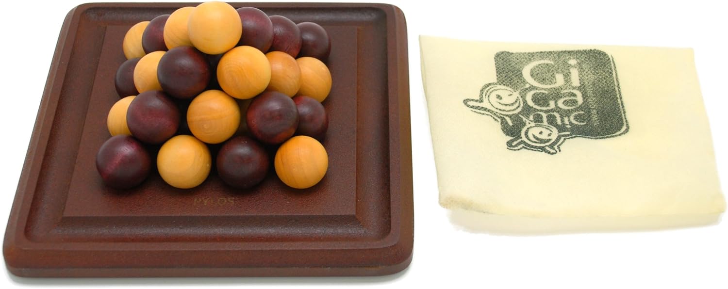 Brown square plate with maroon and orange spherical objects, next to a white cloth with 'Gigamic' branding.