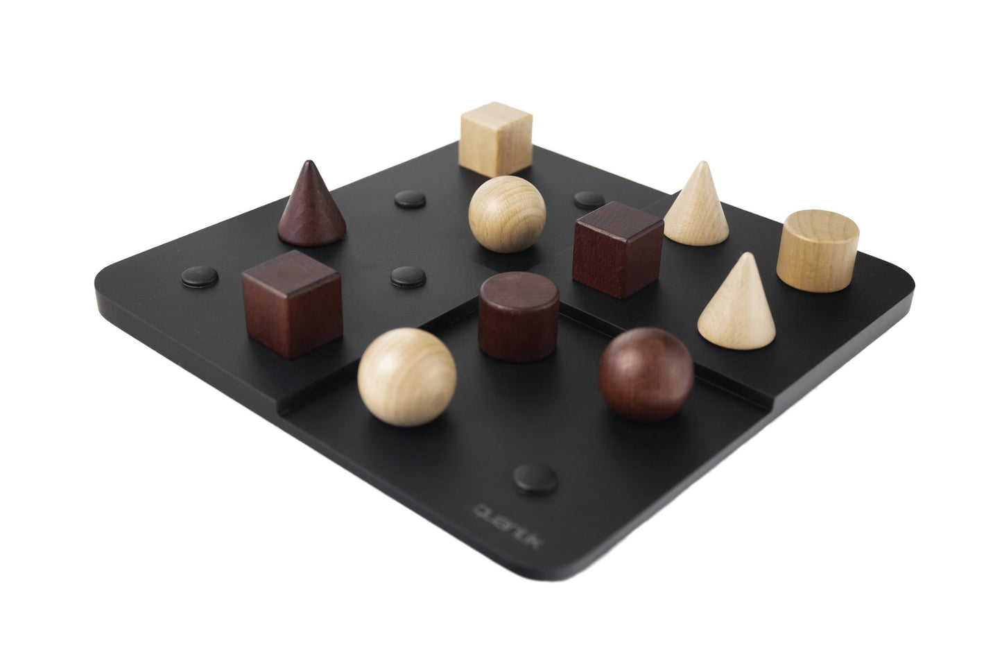 Quantik game board with various shaped wooden objects on a white background