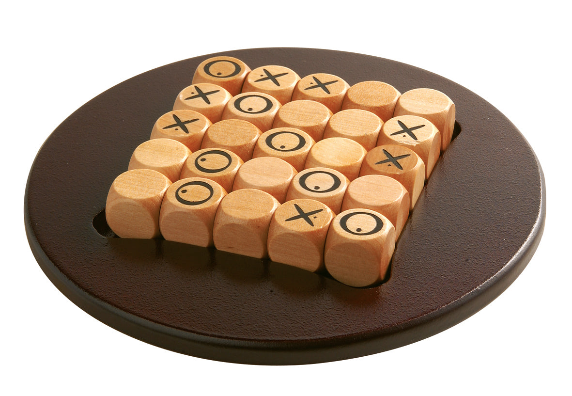 Quixo Mini board game displaying the game's wooden pieces with symbols on them.