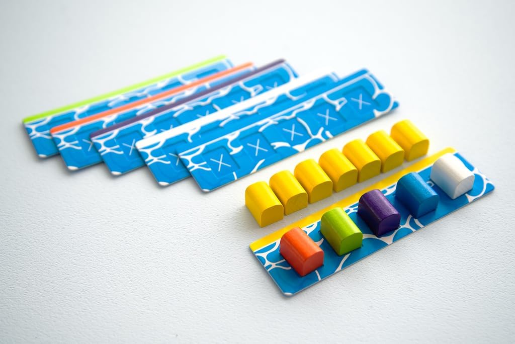 Colourful game pieces and cards on a light grey background