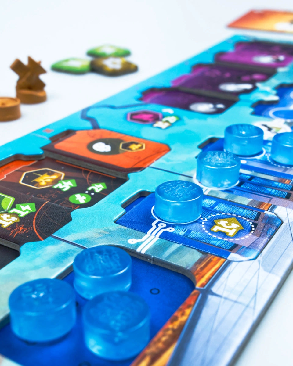 Close-up of a colourful SETI: search for extraterrestrial intelligence board game with translucent blue tokens, dark cards, and small wooden game pieces on a white surface.