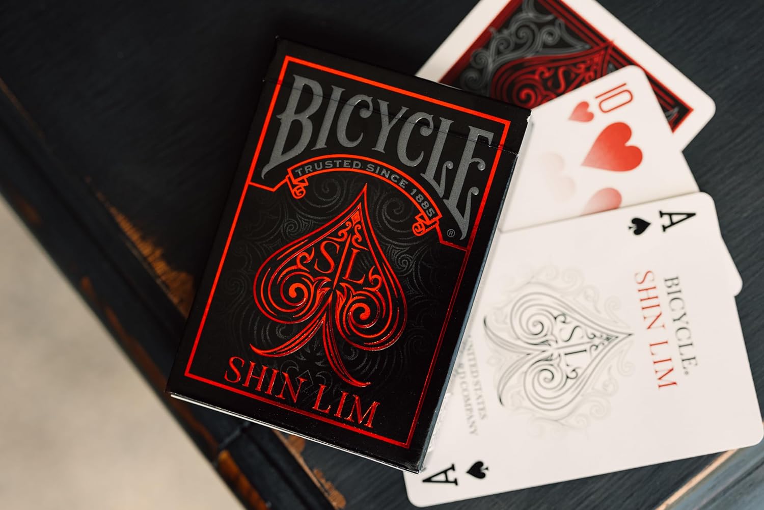Bicycle Shin Lim playing cards with a focus on the red and black deck