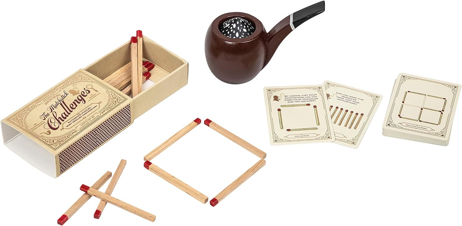 Matchbox, matches, pipe, and cards on a white background