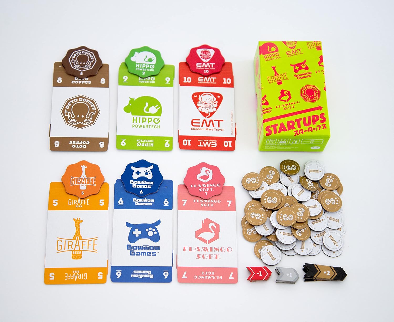 Collection of playing cards and tokens on a white background