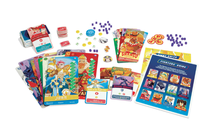 Collection of colourful cards and game components for Tag Team on a white background