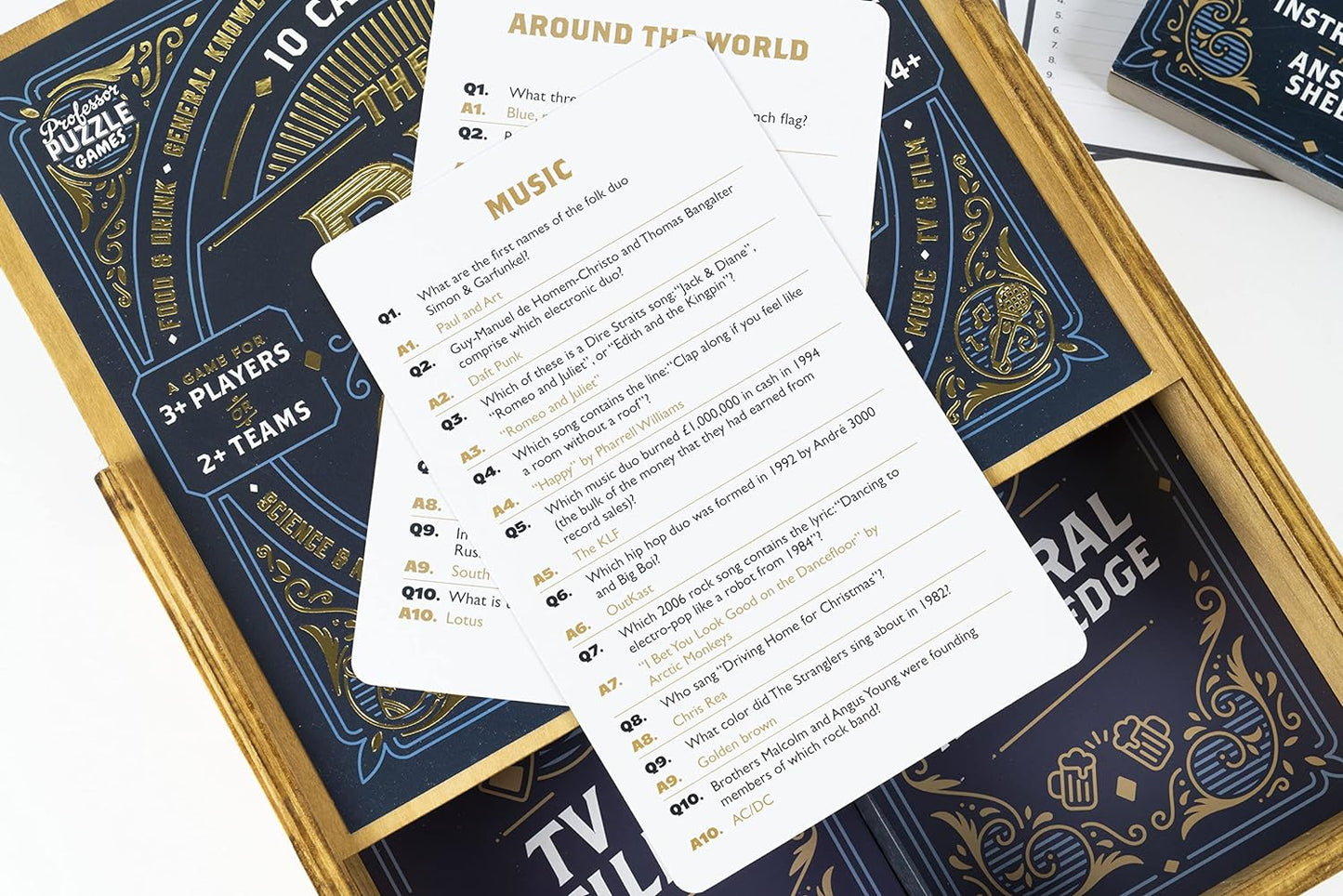 close up of The Big Pub Quiz game wooden product packaging opened showing close up of question cards