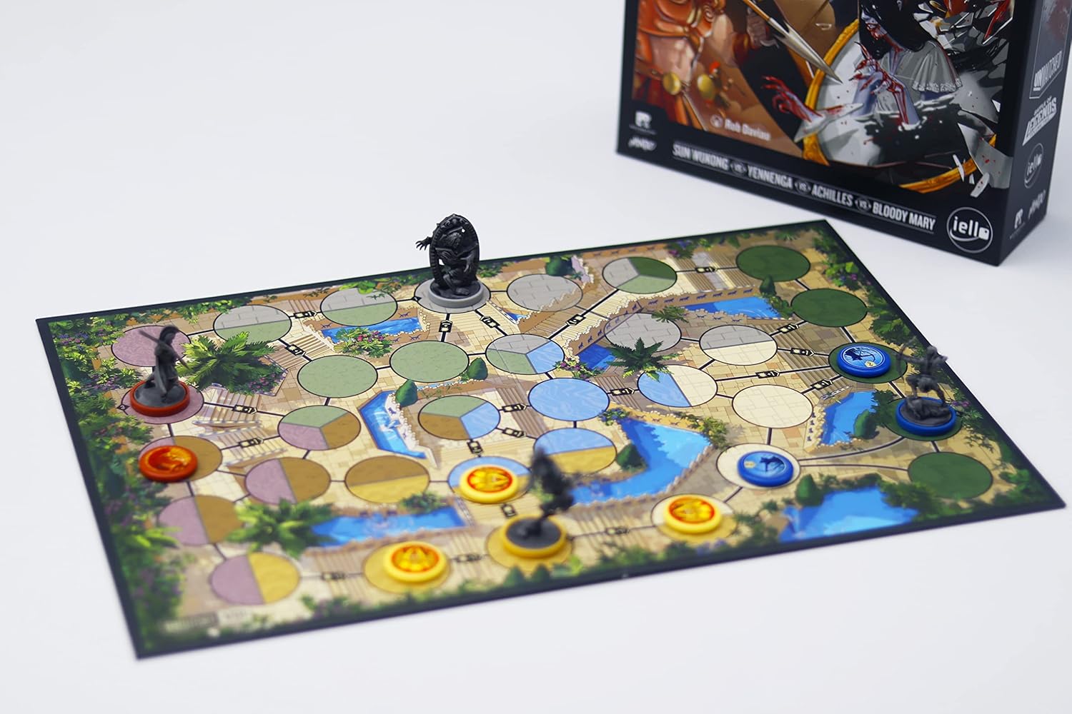 Board game with pieces on a board featuring landscapes and symbols, with a box in the background.
