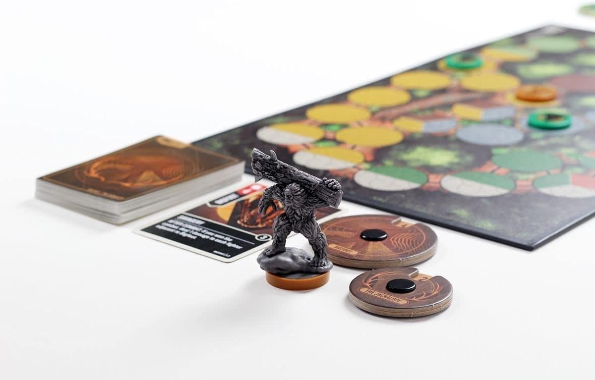 Board game components including a figurine, cards, and game board on a white surface