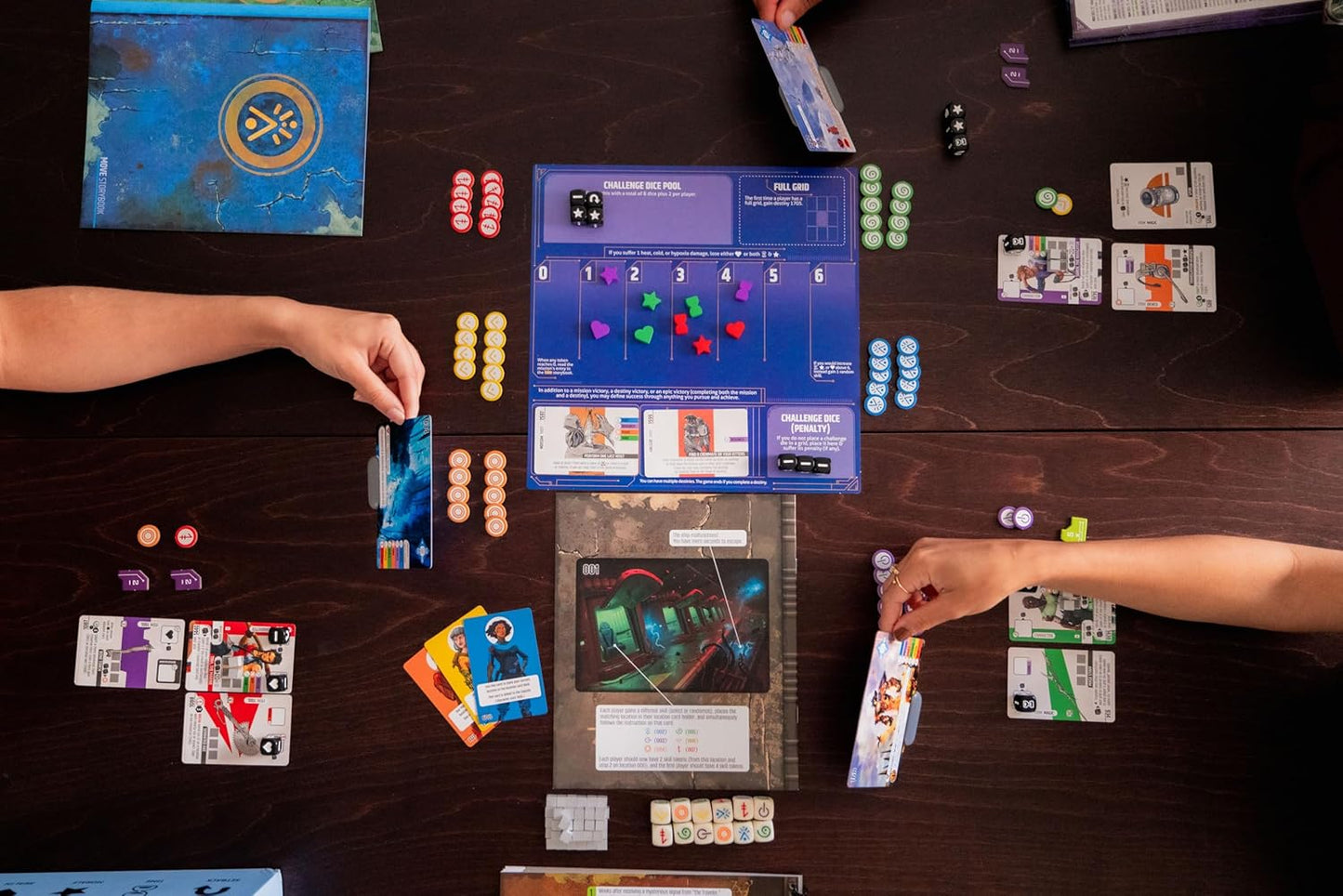 Two people playing a board game with cards and dice on a wooden table.